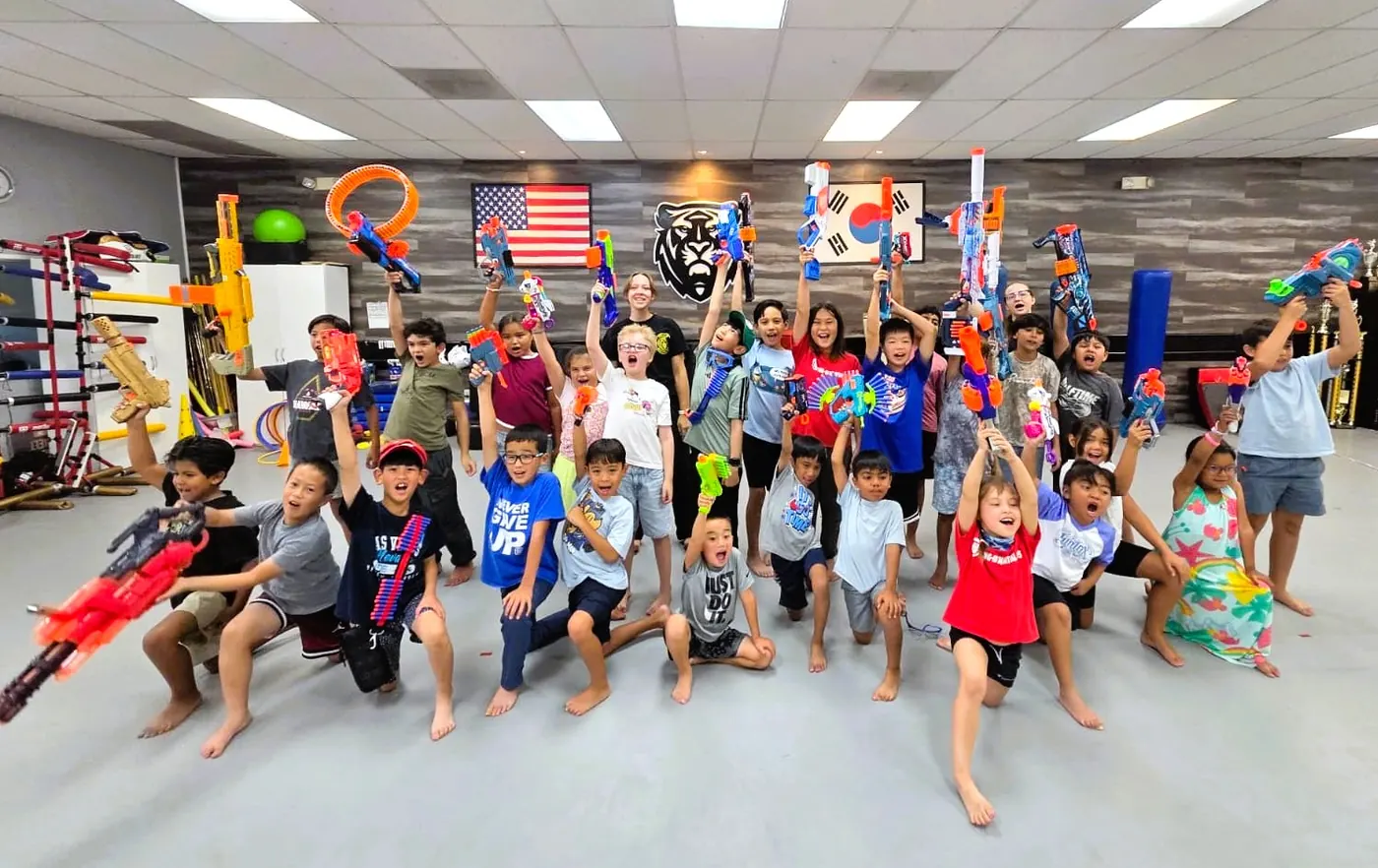 Summer camp group photo on the training floor
